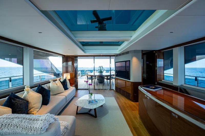 Splash Yacht Photos Pics Luxurious interior of 2022 Princess X95 yacht with ocean view and elegant furnishings.