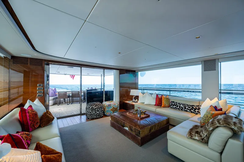 Splash Yacht Photos Pics Luxurious interior of 2022 Princess X95 yacht with ocean view and plush seating.
