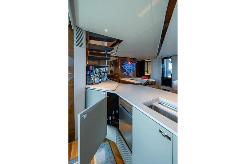 Splash Yacht Photos Pics Luxurious interior of 2022 Princess X95 yacht featuring a modern bar area.