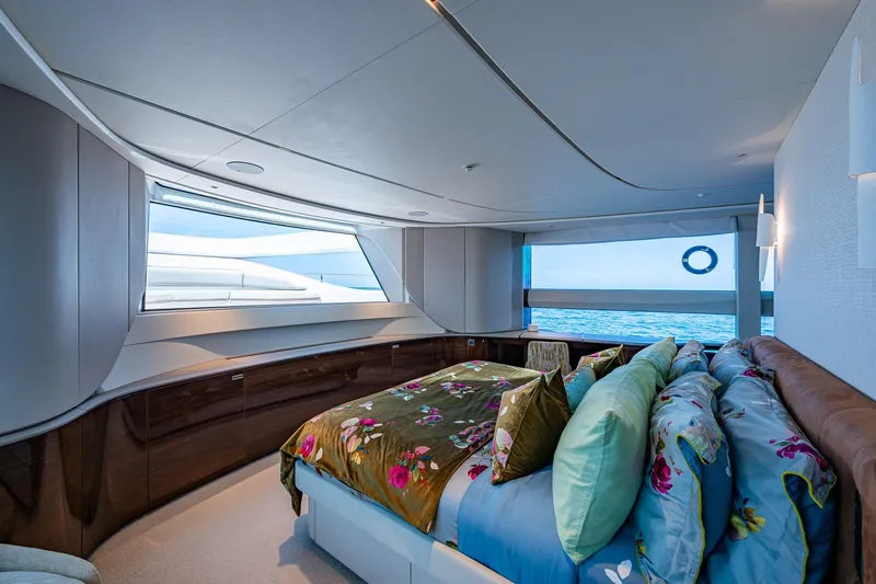 Splash Yacht Photos Pics Luxurious bedroom interior on 2022 Princess X95 yacht with ocean view.