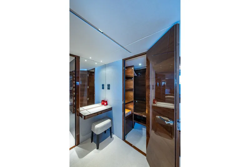 Splash Yacht Photos Pics Luxurious interior of 2022 Princess X95 yacht with elegant wood finishes and modern design.