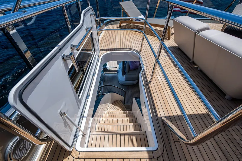 Splash Yacht Photos Pics 2022 Princess X95 yacht deck with open hatch and wooden flooring.
