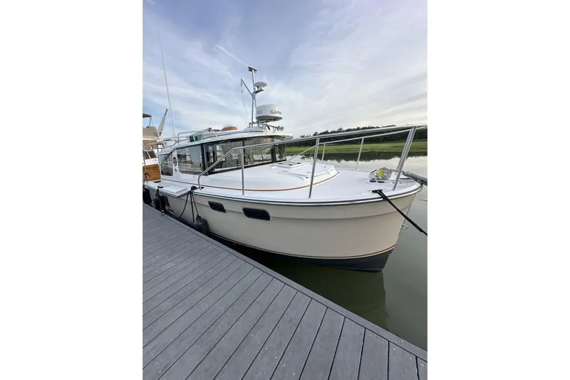 Anima Gemella Yacht Photos Pics 2023 Ranger Tugs R-27 docked, showcasing sleek design and modern features.