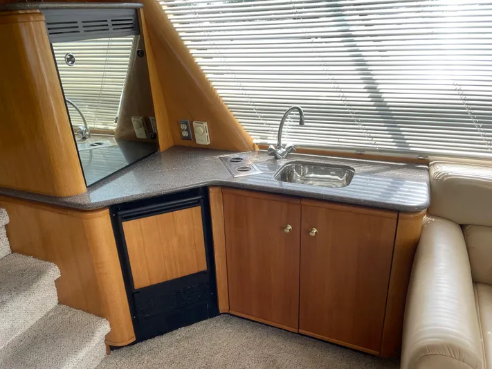  Yacht Photos Pics 1998 Bayliner 4788 Pilot House Motoryacht interior kitchen with sink and cabinets.