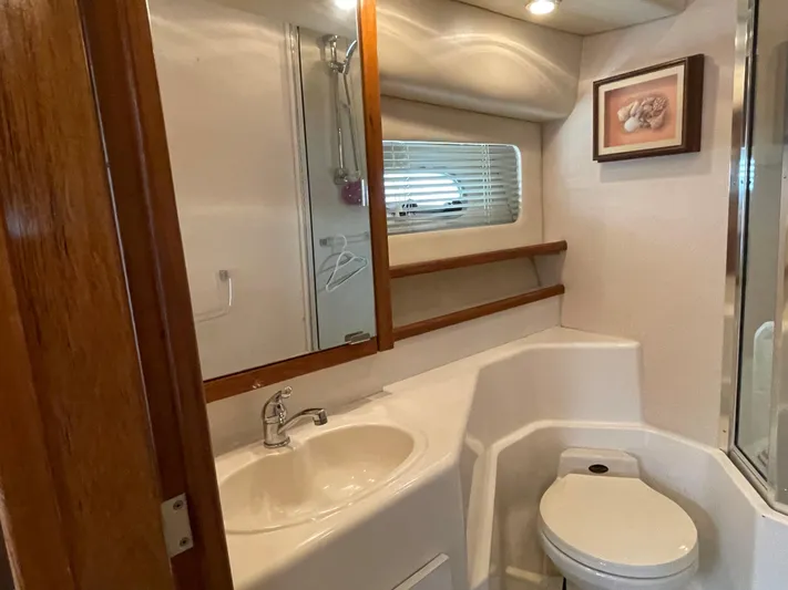  Yacht Photos Pics 1998 Bayliner 4788 Pilot House Motoryacht bathroom with sink, toilet, and shower.