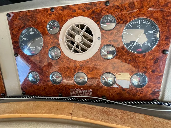  Yacht Photos Pics Dashboard of a 1998 Bayliner 4788 Pilot House Motoryacht with gauges and air vent.