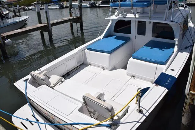 Rampage Yacht Photos Pics dockside with cushions out on engine boxes