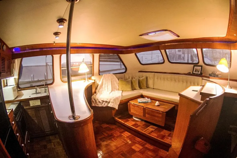  Yacht Photos Pics Luxurious 1982 Cheoy Lee 52 yacht interior with cozy seating and elegant wood finishes.