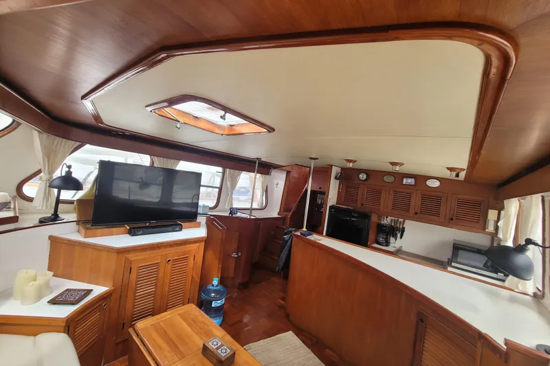  Yacht Photos Pics Interior of 1982 Cheoy Lee 52 yacht with wood paneling and modern amenities.