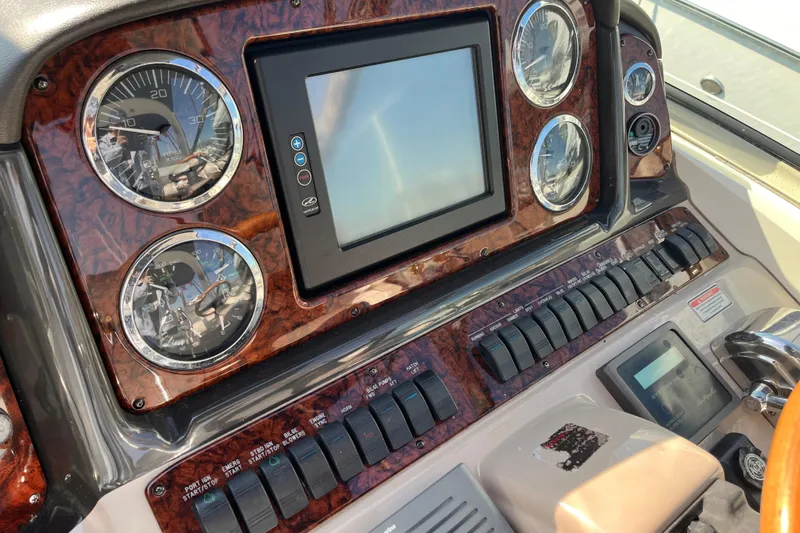  Yacht Photos Pics Dashboard of 2004 Searay 420 Sundancer with gauges and control panel.
