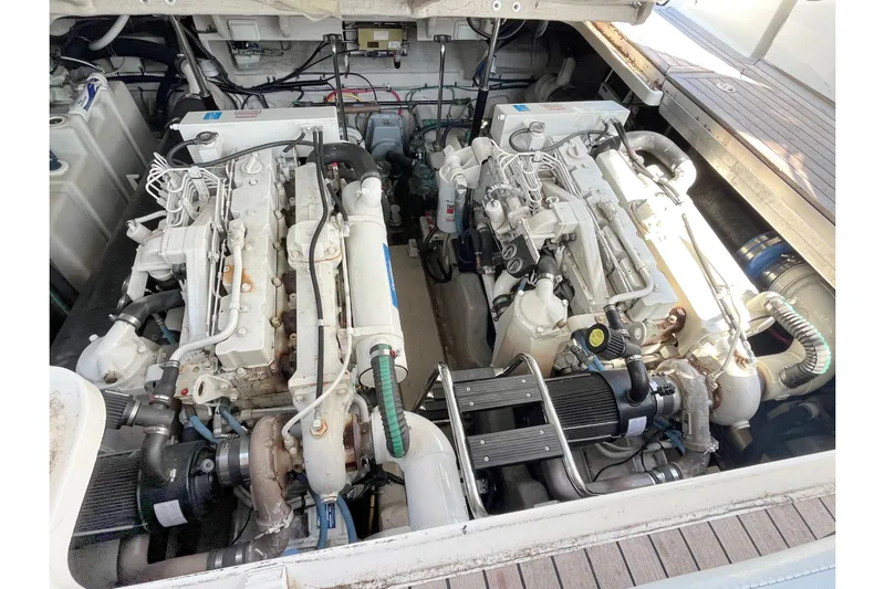  Yacht Photos Pics Engine compartment of 2004 Searay 420 Sundancer with dual engines and mechanical components.