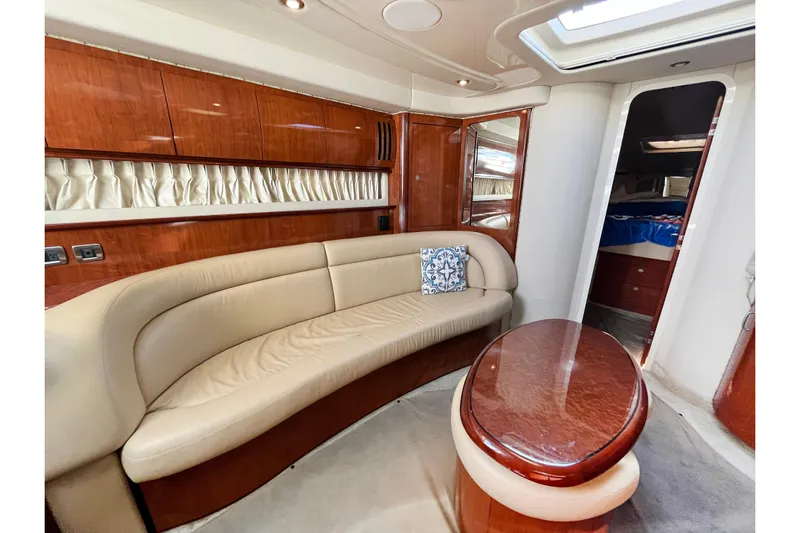  Yacht Photos Pics Luxurious 2004 Searay 420 Sundancer yacht interior with elegant seating and wooden finishes.