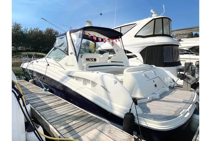  Yacht Photos Pics 2004 Searay 420 Sundancer yacht docked at marina under clear blue sky.