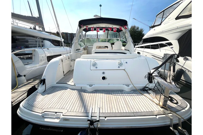  Yacht Photos Pics 2004 Searay 420 Sundancer yacht docked, rear view with spacious deck and seating.