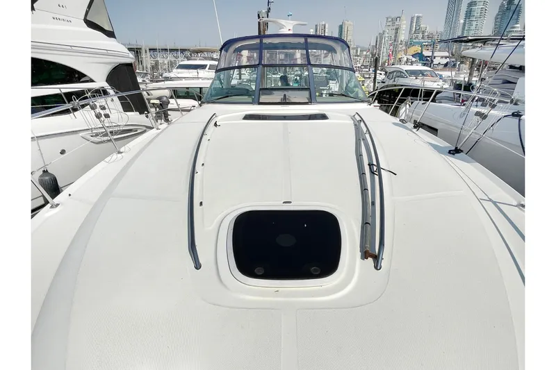  Yacht Photos Pics 2004 Searay 420 Sundancer yacht deck view at marina, surrounded by boats.
