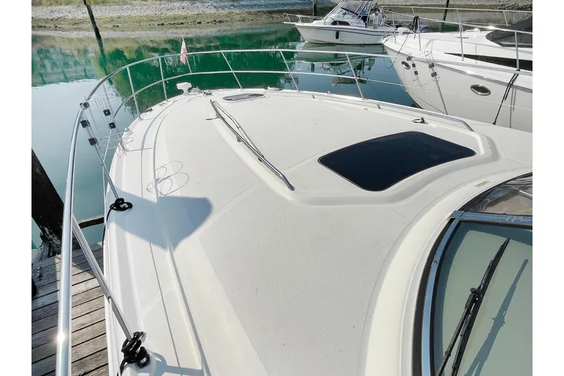  Yacht Photos Pics 2004 Searay 420 Sundancer yacht deck with railing, docked in marina.