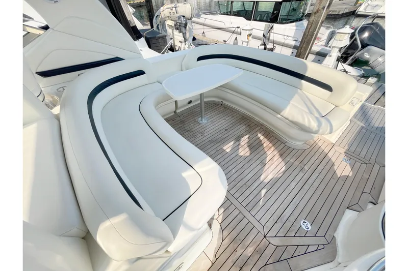  Yacht Photos Pics Luxurious seating area on 2004 Searay 420 Sundancer yacht with elegant wood flooring.