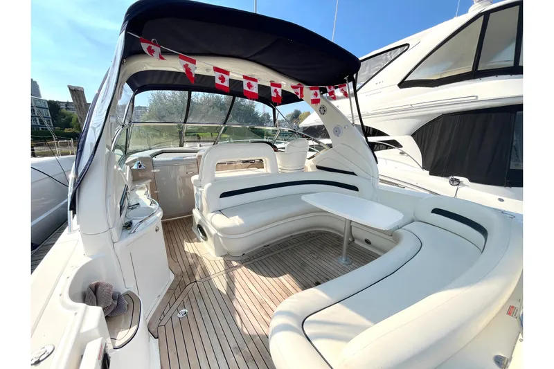  Yacht Photos Pics 2004 Searay 420 Sundancer yacht interior with white seating and Canadian flag decorations.