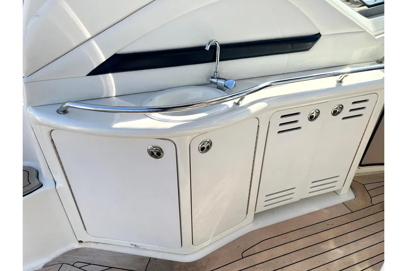 Yacht Photos Pics 2004 Searay 420 Sundancer yacht sink and storage area on deck.