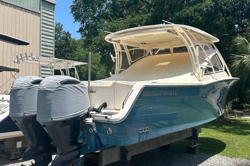  Yacht Photos Pics 2020 Grady-White Freedom 307 boat with dual engines, docked outdoors.