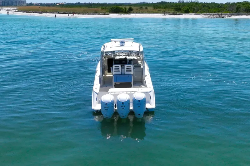  Yacht Photos Pics 2008 Hydra-Sports Vector 3500 VX boat on calm blue water near shoreline.