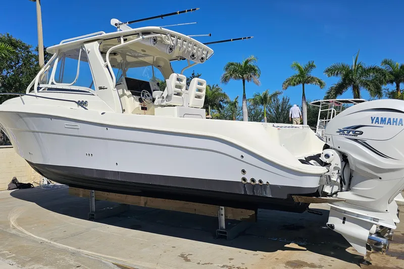  Yacht Photos Pics 2008 Hydra-Sports Vector 3500 VX boat with Yamaha engine, docked under clear blue sky.