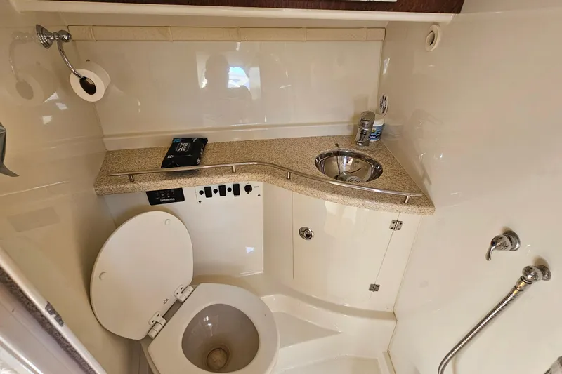  Yacht Photos Pics 2008 Hydra-Sports Vector 3500 VX boat bathroom with toilet, sink, and showerhead.