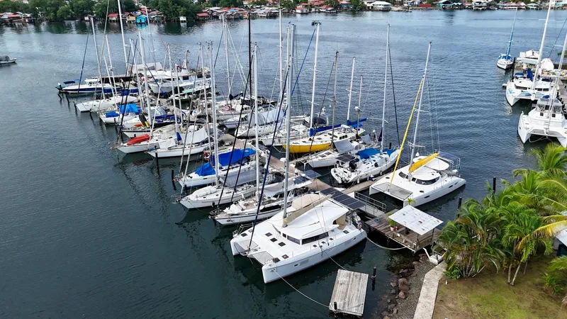 Road Less Travelled Yacht Photos Pics Aerial view of a marina with multiple sailboats, including a 2013 Lagoon 421 catamaran.