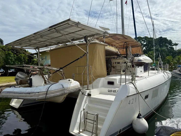 Road Less Travelled Yacht Photos Pics 2013 Lagoon 421 catamaran docked with dinghy and solar panels.