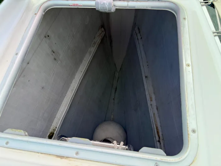 Road Less Travelled Yacht Photos Pics Open storage compartment on 2013 Lagoon 421 catamaran, showing interior space and equipment.