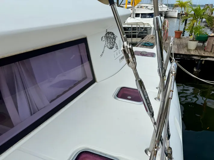 Road Less Travelled Yacht Photos Pics 2013 Lagoon 421 catamaran docked, featuring sleek design and visible rigging.