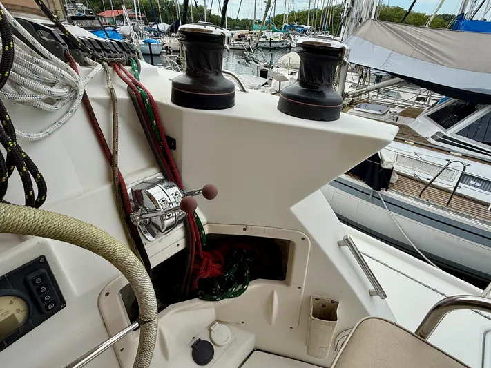 Road Less Travelled Yacht Photos Pics Sailing yacht Lagoon 421 cockpit with winches and ropes, docked in a marina, 2013 model.