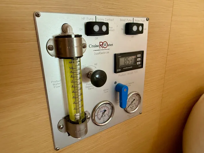 Road Less Travelled Yacht Photos Pics Control panel of a 2013 Lagoon 421 yacht water system, featuring gauges and switches.