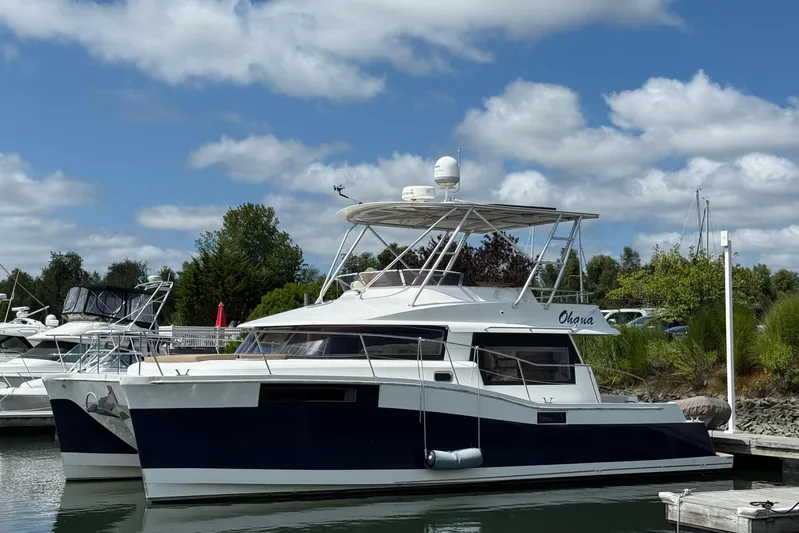 Ohana Yacht Photos Pics 2015 Fountaine Pajot Summerland 40 LC catamaran docked under a blue sky.