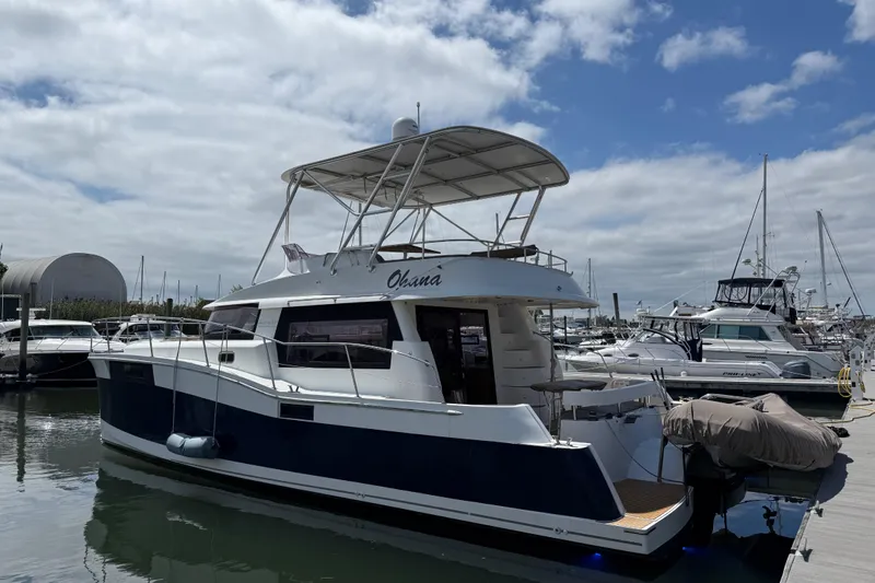 Ohana Yacht Photos Pics 2015 Fountaine Pajot Summerland 40 LC yacht docked at marina under cloudy sky.