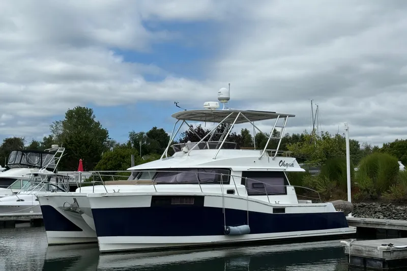 Ohana Yacht Photos Pics 2015 Fountaine Pajot Summerland 40 LC catamaran docked in a marina.