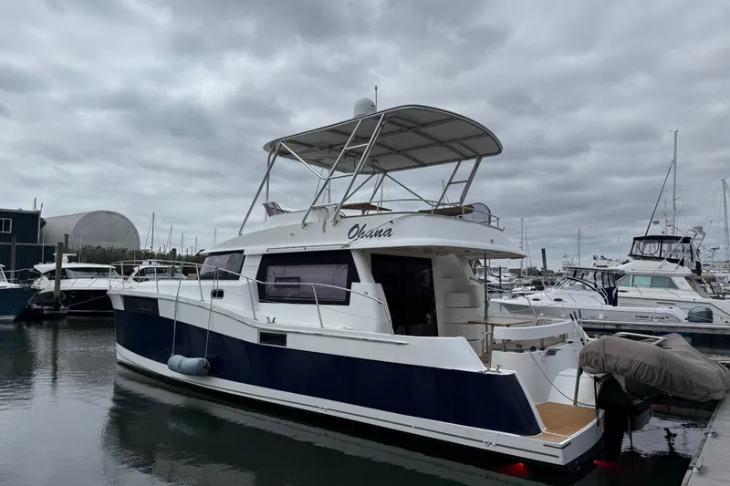 Ohana Yacht Photos Pics 2015 Fountaine Pajot Summerland 40 LC yacht docked at marina under cloudy sky.