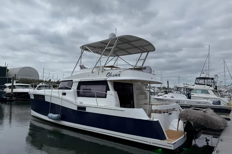 Ohana Yacht Photos Pics 2015 Fountaine Pajot Summerland 40 LC yacht docked at marina under cloudy skies.