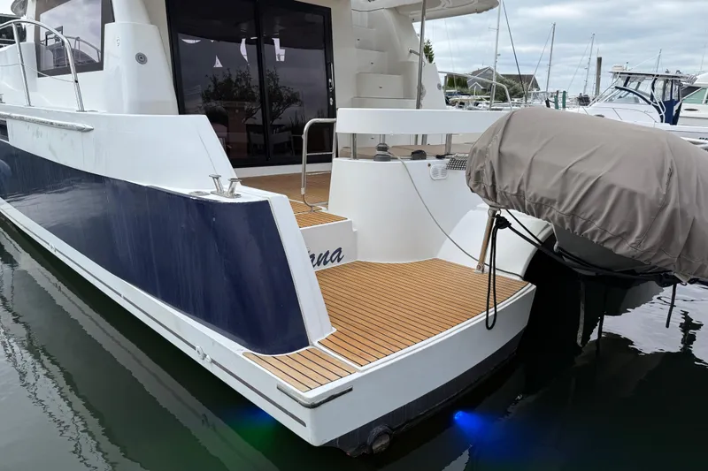 Ohana Yacht Photos Pics 2015 Fountaine Pajot Summerland 40 LC yacht docked, featuring sleek design and wooden deck.