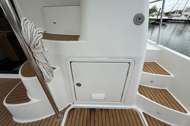 Ohana Yacht Photos Pics Staircase and storage on 2015 Fountaine Pajot Summerland 40 LC yacht deck.