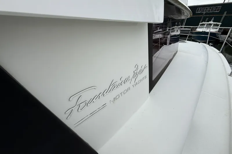 Ohana Yacht Photos Pics 2015 Fountaine Pajot Summerland 40 LC motor yacht, sleek design, docked at marina.