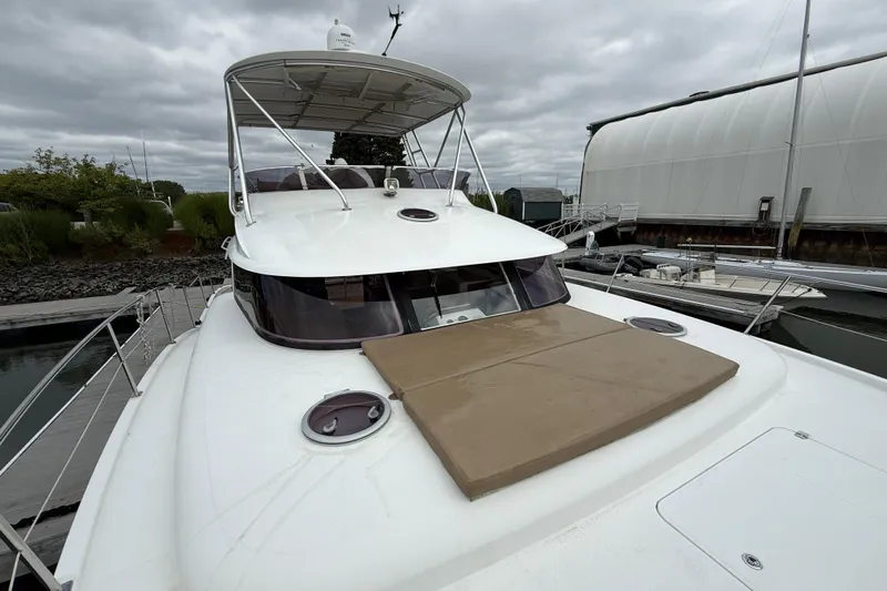 Ohana Yacht Photos Pics 2015 Fountaine Pajot Summerland 40 LC yacht docked at marina under cloudy sky.