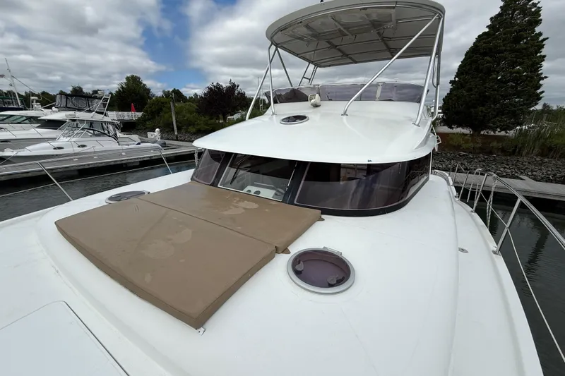 Ohana Yacht Photos Pics 2015 Fountaine Pajot Summerland 40 LC yacht docked, featuring spacious deck and canopy.