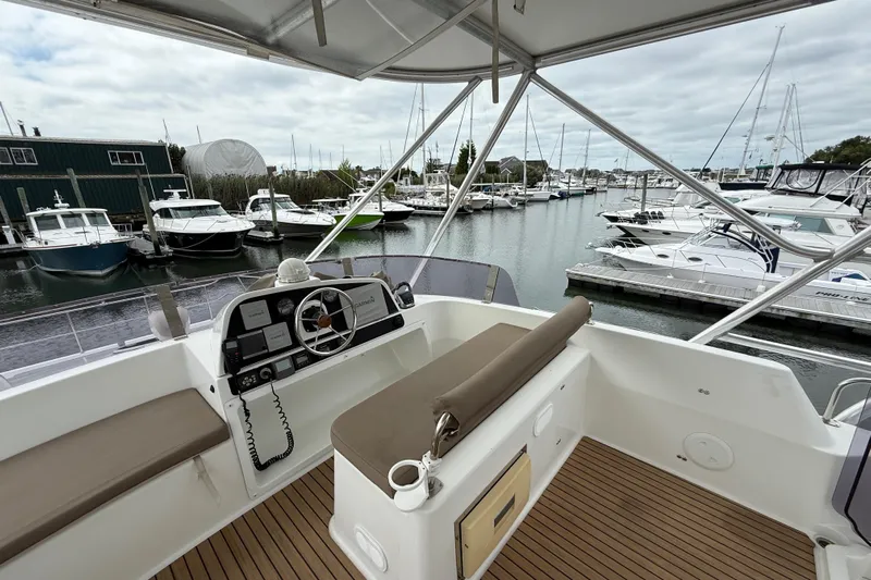 Ohana Yacht Photos Pics Flybridge view of 2015 Fountaine Pajot Summerland 40 LC in marina setting.