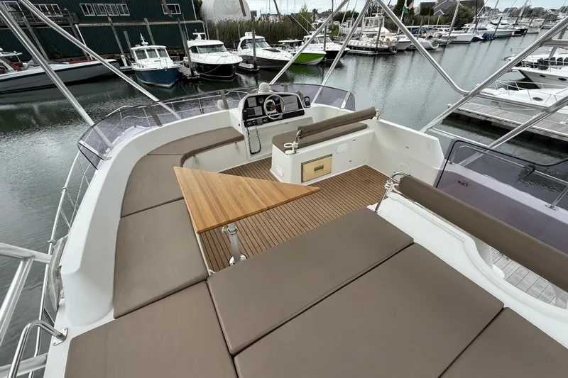 Ohana Yacht Photos Pics Flybridge of 2015 Fountaine Pajot Summerland 40 LC with seating and table, docked at marina.