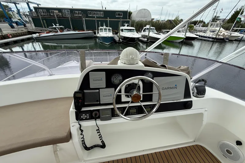 Ohana Yacht Photos Pics Helm of 2015 Fountaine Pajot Summerland 40 LC with Garmin navigation, docked at marina.