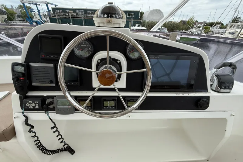 Ohana Yacht Photos Pics Helm of 2015 Fountaine Pajot Summerland 40 LC with navigation instruments and steering wheel.