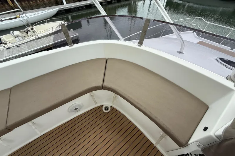Ohana Yacht Photos Pics 2015 Fountaine Pajot Summerland 40 LC boat with cushioned seating and wooden deck.