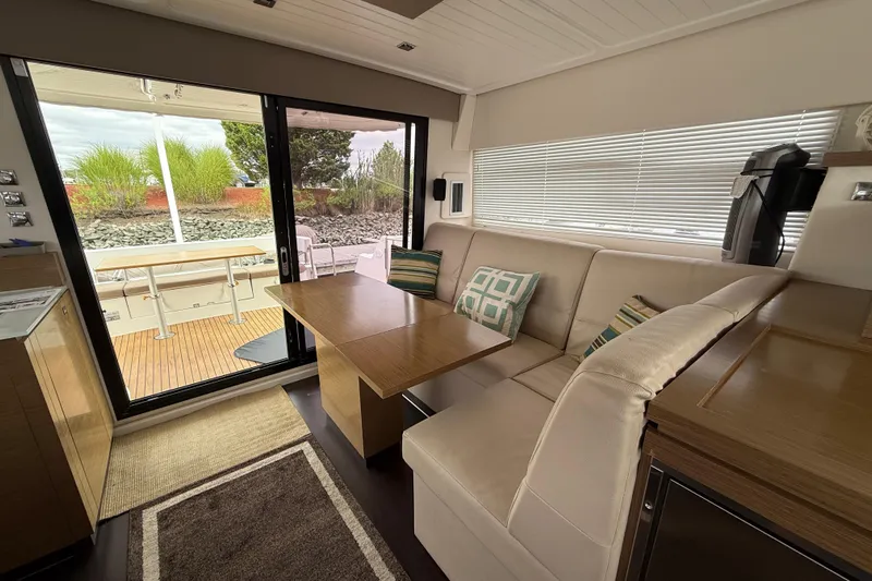 Ohana Yacht Photos Pics Interior of 2015 Fountaine Pajot Summerland 40 LC yacht with cozy seating and table.