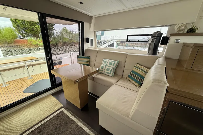 Ohana Yacht Photos Pics Interior of 2015 Fountaine Pajot Summerland 40 LC with cozy seating and table.
